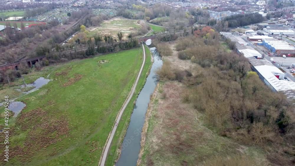 Drones flight over a river in a park overlooking a railroad track Drones flight over a river in a park overlooking a railroad track
