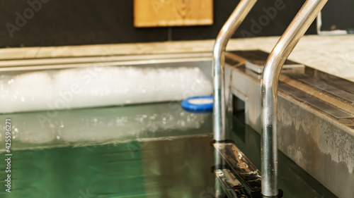 Принти на полотні Ladder with handrails leading to the pool with ice cold water for body hardening in the sauna complex