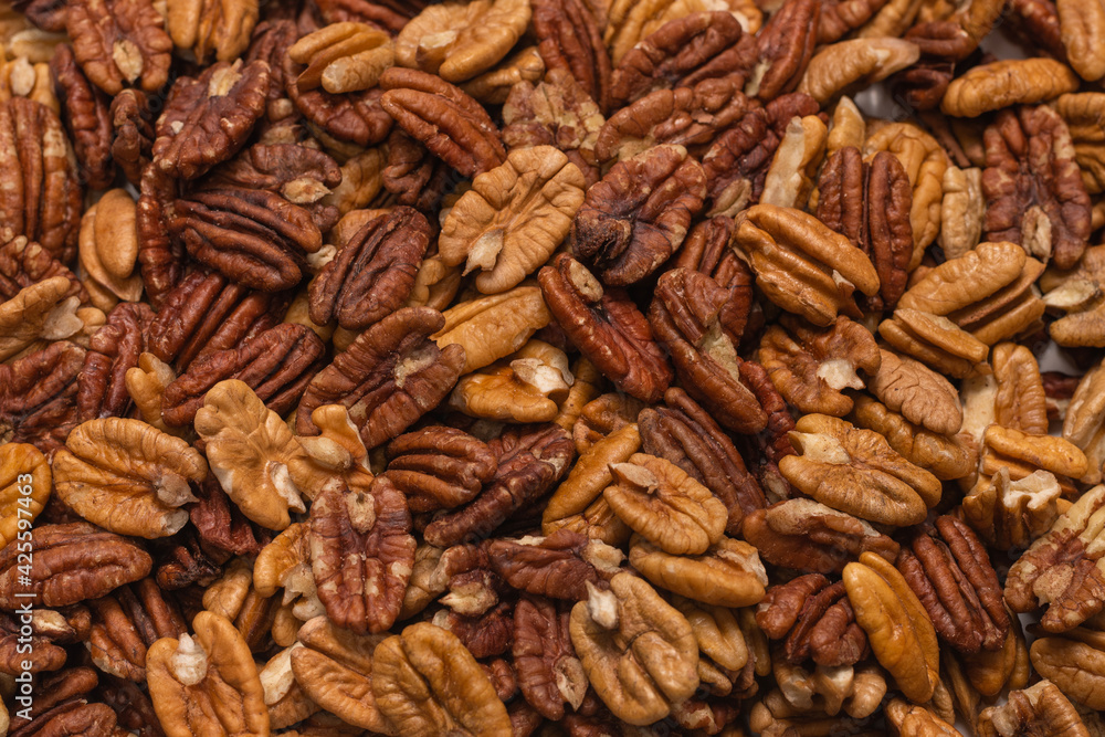 Tasty pecan-nut background. Top view. Tasty pecan-nut background. Top view.