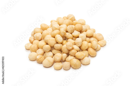 Macadamia nuts isolated on white background.