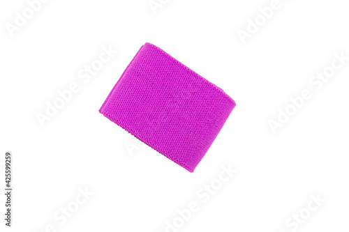 Purple textile woven fitness sports elastic band twisted rolled isolated on white background. Top view. Flat lay. Close up. Copy space © geniousha