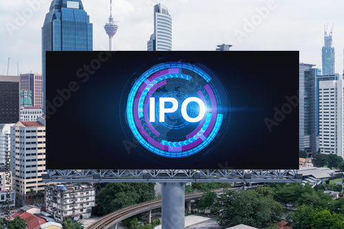Photography IPO icon hologram on road billboard over day time panorama city view of Kuala Lumpur