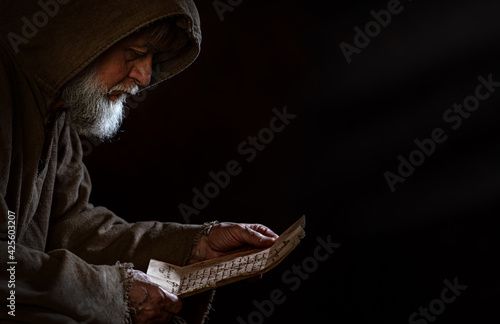 Tela Medieval poor beggar reads a letter