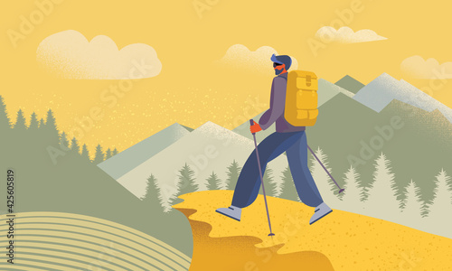Backpacker, hiker or explorer walking on a mountain trail against the background of mountains. 