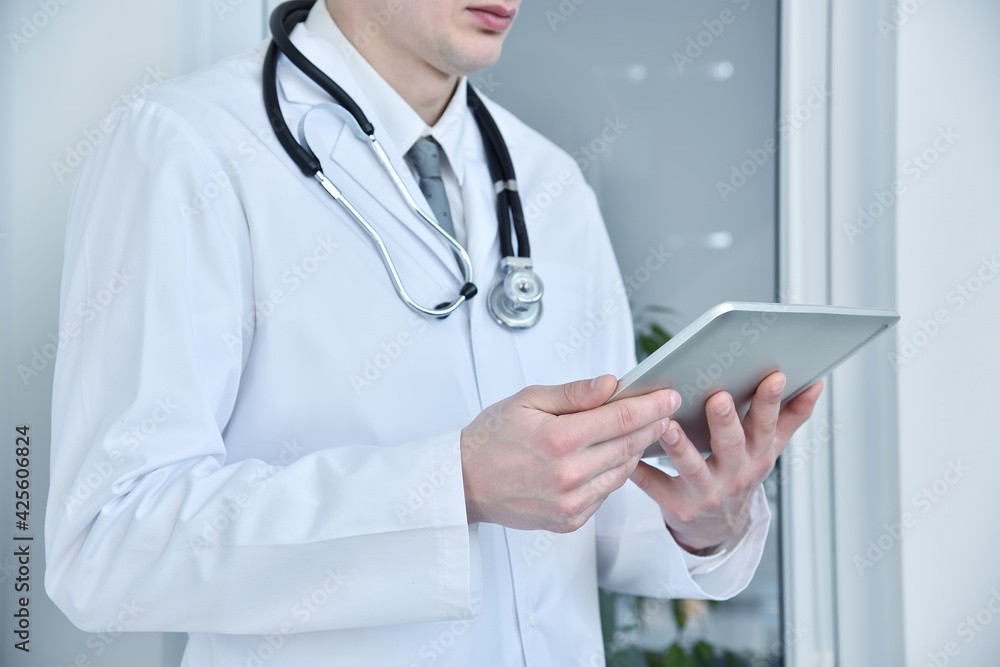 Doctor holding a touch pad tablet computer. Doctor holding a touch pad tablet computer.