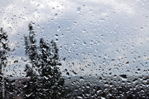Rain drops on the window glass during thunderstorm © Svetlana