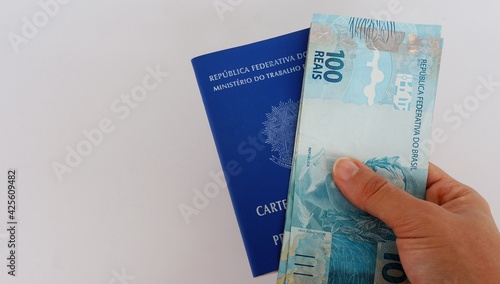 Carteira de Trabalho do Brasil e dinheiro Brasileiro. photo