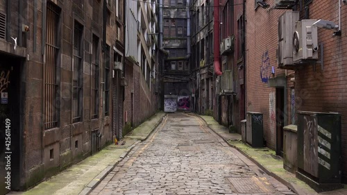 A Grungy and Dangerous Empty Alley In A Big City photo