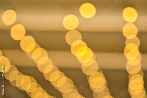 Canvas Print Beautiful cozy gold view of distant orange bokeh lights in Stephens Green Green Park, Dublin, Ireland