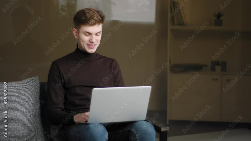 Happy young man millennial user making online call using laptop and modern computer app at home for remote conversation. Caucasian guy teen male student laughing talking to friends on video conference Happy young man millennial user making online call using laptop and modern computer app at home for remote conversation. Caucasian guy teen male student laughing talking to friends on video conference
