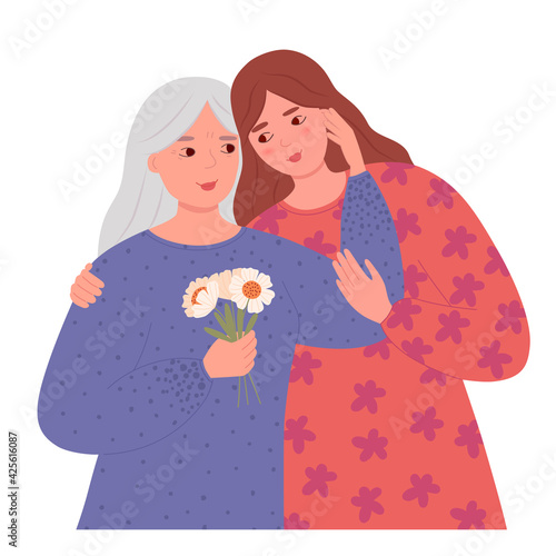 Happy Mothers Day. Senior mother and her adult daughter embrace and look at each other. The concept of holiday greetings, motherhood and care