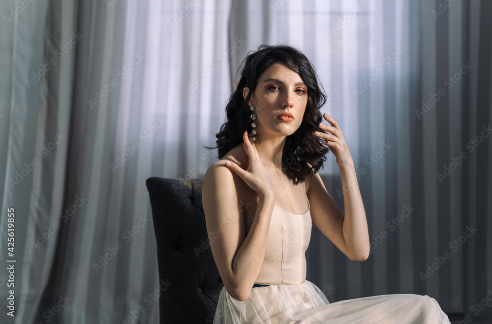 Close up studio portrait of a pretty brunettes. Looks straight into the camera.