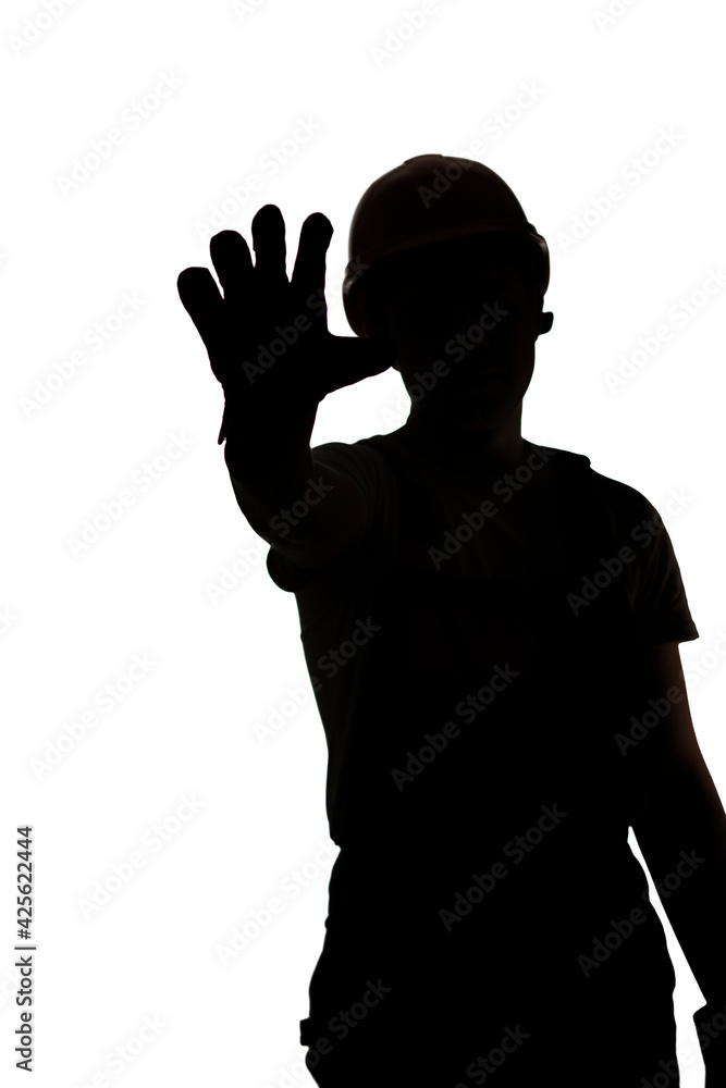 silhouette of builder in hard hat showing palm forbidding gesture stop, warning hand sign,workers protest