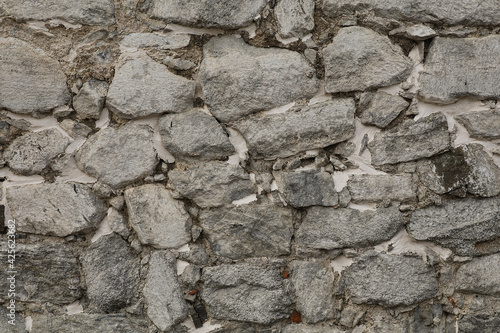 Billede på lærred Old stone wall. Texture of gray masonry