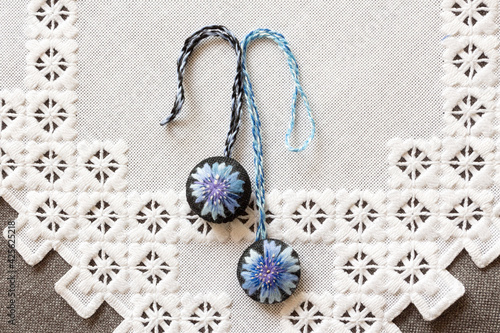 hand-embroidered keychains on a napkin