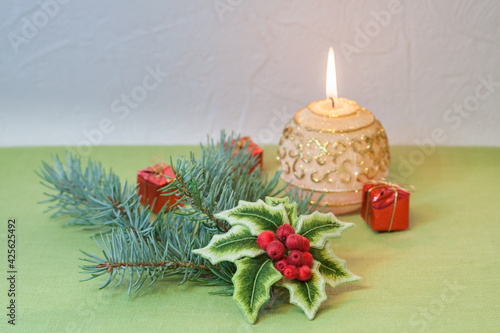 embroidered holly branch with candle
