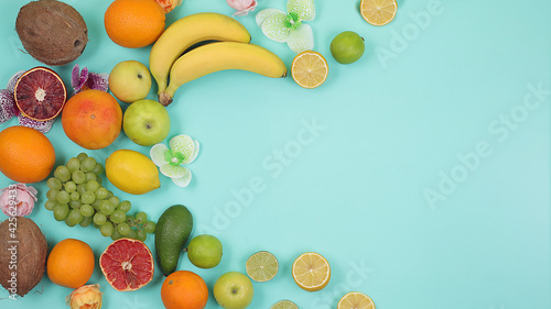 Fototapeta Naklejka Na Ścianę i Meble -  Detox diet and weight loss concept. summer tropical fruits on bright table with place for text, top view, healthy and natural food, source of vitamin C, banner for shop, selective focus