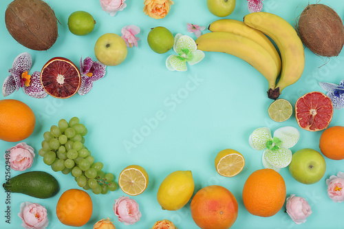 Fototapeta Naklejka Na Ścianę i Meble -  Detox diet and weight loss concept. summer tropical fruits on bright table with place for text, top view, healthy and natural food, source of vitamin C, banner for shop, selective focus