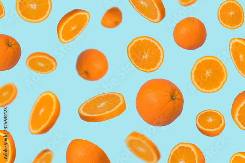 Minimal idea with fresh orange sliced on pastel blue background. Minimal fruit concept.