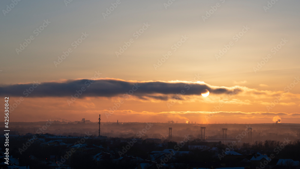 Sunset over the city. View from above. City concept Sunset over the city. View from above. City concept