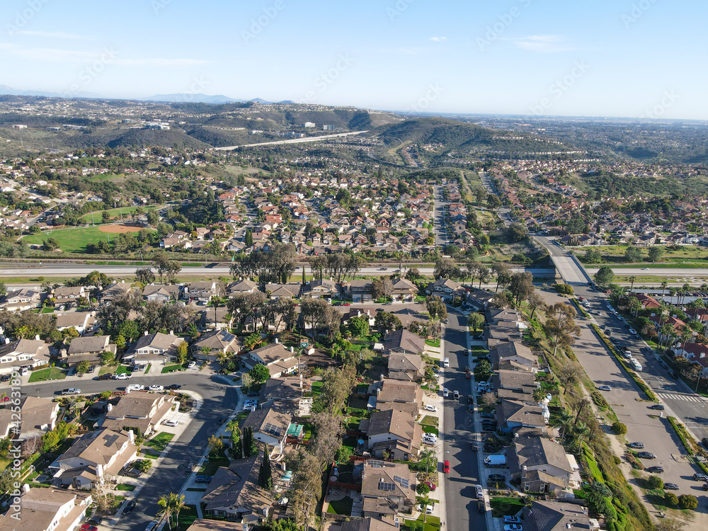 Fototapeta premium Aerial view of Carmel Mountain neighborhood with Black Mountain. San Diego County, California.