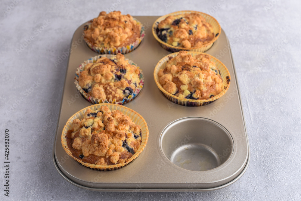 Delicious crumble muffins in baking form