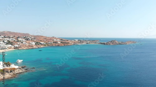 Aerial panoramic rotating view of the famous Platis Gialos Mykonos beach Cyclades Greece. photo