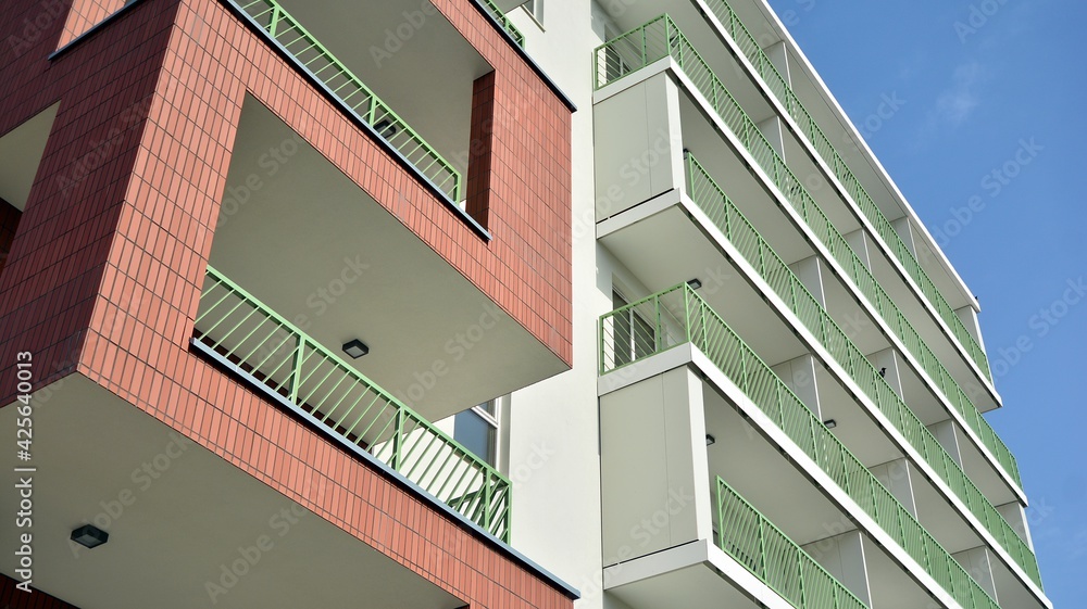 Fototapeta premium Part of city real estate property and condo architecture. Detail in modern residential flat apartment building exterior. Fragment of New luxury house and home complex. 