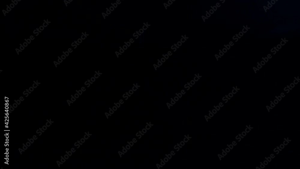 Falling juicy pieces of pineapple on a black background. Slow motion. Falling juicy pieces of pineapple on a black background. Slow motion.