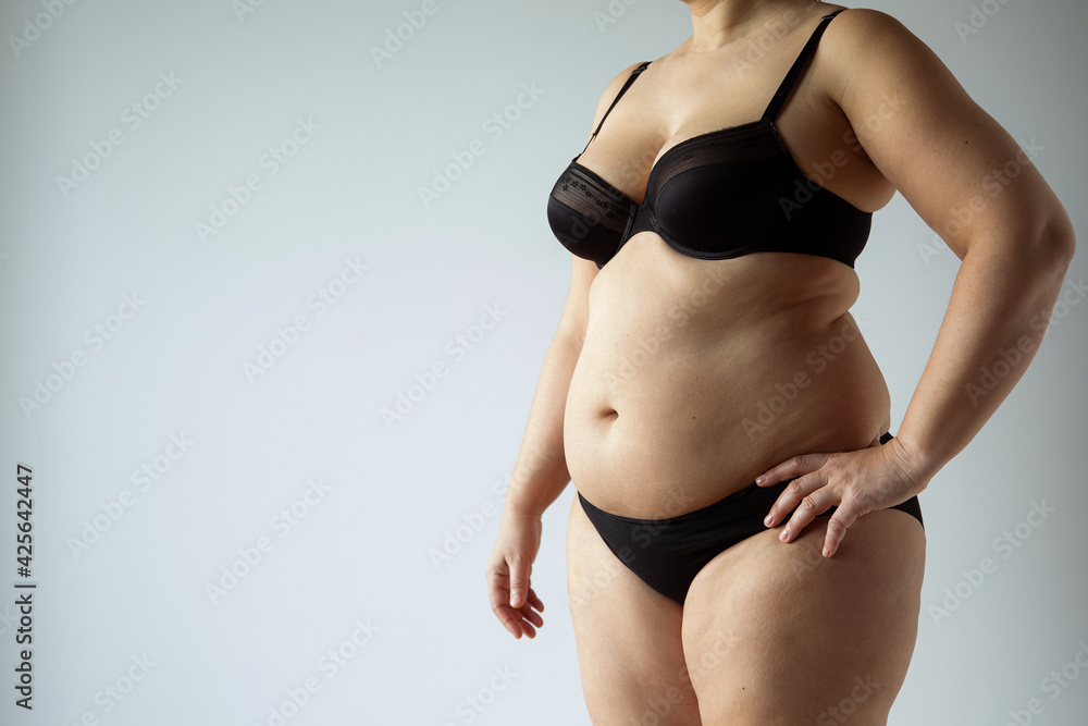 middle aged curvy woman body with belly diet concept Stock Photo