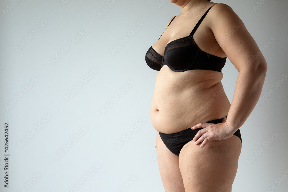 middle aged curvy woman body with belly diet concept