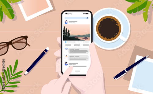 Using social media at home office - Hand holding phone and checking SOME with table in background. Top view. Editable vector illustration mockup.