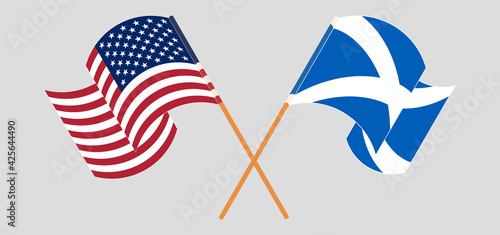 Crossed and waving flags of the USA and Scotland