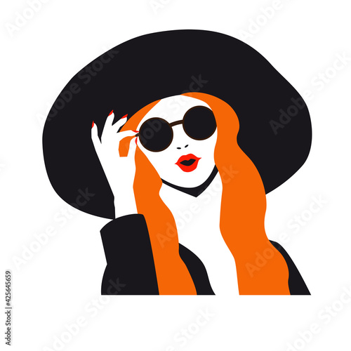 Surprised delighted girl in a black hat and black round sunglasses © valentinash