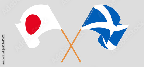 Crossed and waving flags of Japan and Scotland