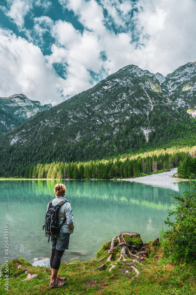 Backpacker on hiking trails in the Dolomites, Italy. Backpacker on hiking trails in the Dolomites, Italy.