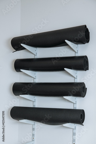 yoga mats folded on the wall