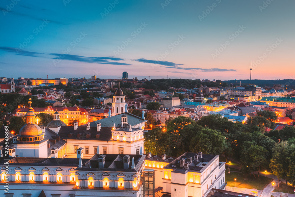 Vilnius, Lithuania, Eastern Europe. Aerial View Of Historic Center Cityscape In Blue Hour After Sunset. Old Town In Night Illuminations. UNESCO. Palace Of The Grand Dukes Of Lithuania
