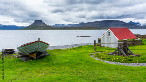 buildings and boats on the remote island of Vigur, on the Icelandic north western coast during summer season photo