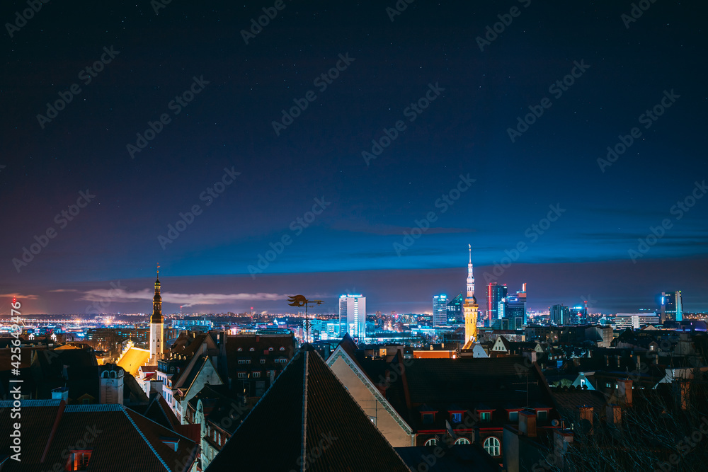 Fototapeta premium Tallinn, Estonia, Europe. Natural Night Starry Sky Above Tallinn Skyline Cityscape. Old Town And Modern City. Popular Place With Famous Landmarks. UNESCO