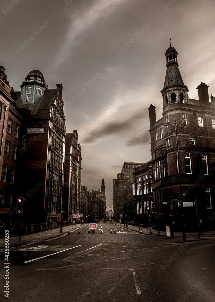 View of the city of Manchester in England, old industrial buildings, picture taken in the evening, vintage look