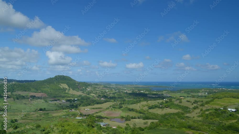 Aerial of houses on green remote landscape Aerial of houses on green remote landscape