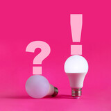 Light bulbs on magenta background. Question and answer, problem and solution, idea creative concept.