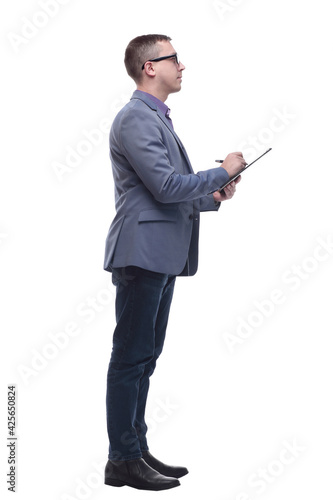 Smiling young businessman with holding notebook and looking forward.