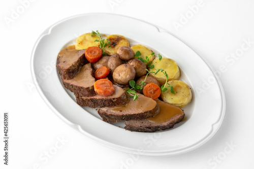 Sliced meat delicacies. Delicious beef, pork and poultry. Banquet festive dishes. Gourmet restaurant menu. White background.