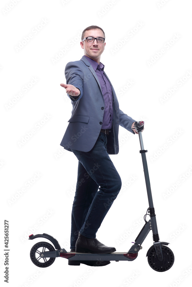 Pleasant smiling man riding a kick scooter Pleasant smiling man riding a kick scooter