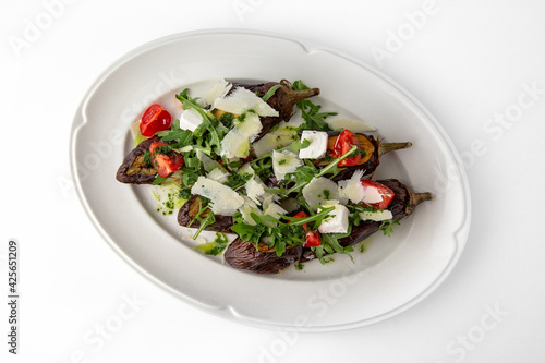 Eggplant baked with tomatoes, zucchini, parmesan. Banquet festive dishes. Gourmet restaurant menu. White background.