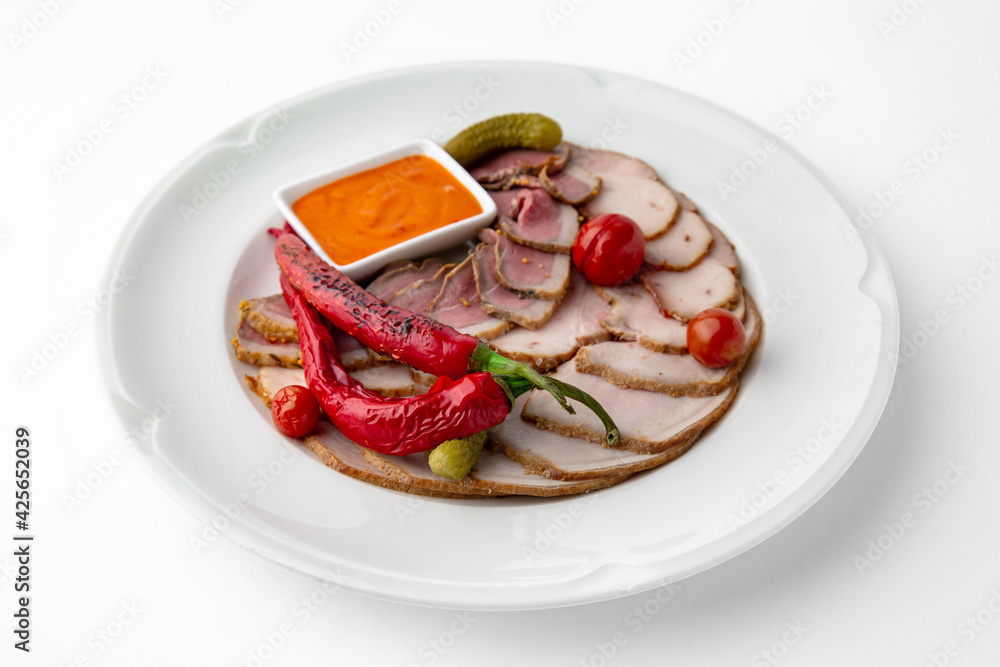 Sliced meat delicacies. Delicious beef, pork and poultry. Banquet festive dishes. Gourmet restaurant menu. White background. Sliced meat delicacies. Delicious beef, pork and poultry. Banquet festive dishes. Gourmet restaurant menu. White background.