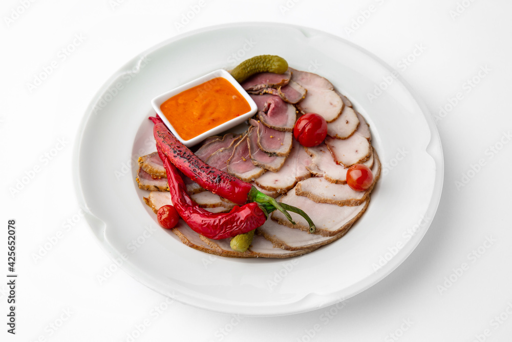 Sliced meat delicacies. Delicious beef, pork and poultry. Banquet festive dishes. Gourmet restaurant menu. White background. Sliced meat delicacies. Delicious beef, pork and poultry. Banquet festive dishes. Gourmet restaurant menu. White background.