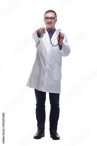 Front view of male doctor holding stethoscope against white background